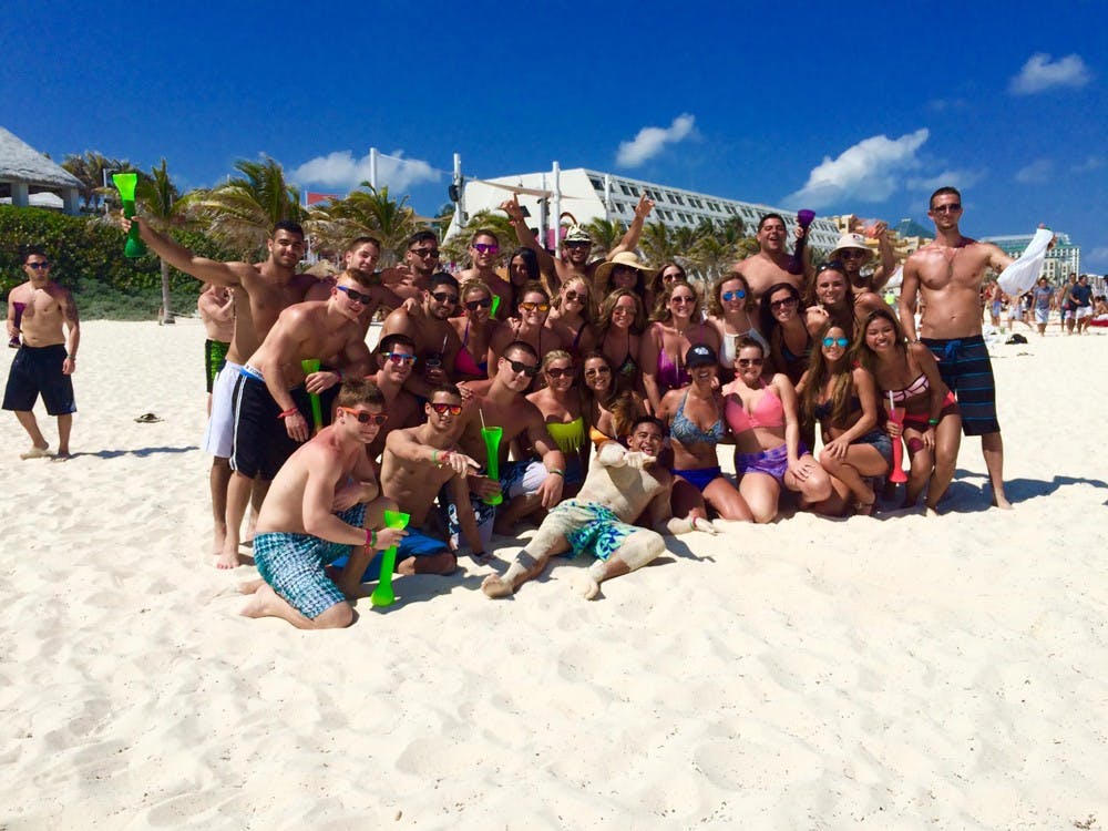 <p>David Rubino and his friends pose for a photo during a spring break trip.&nbsp;While some students choose to stay home during spring break, others go on tropical vacations.&nbsp;</p>