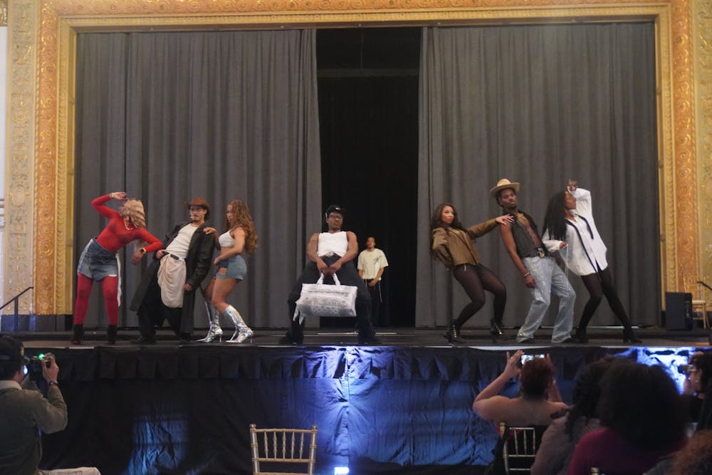 Students pose on the runaway during the Black Student Union's annual 'Black Explosion' Saturday. 