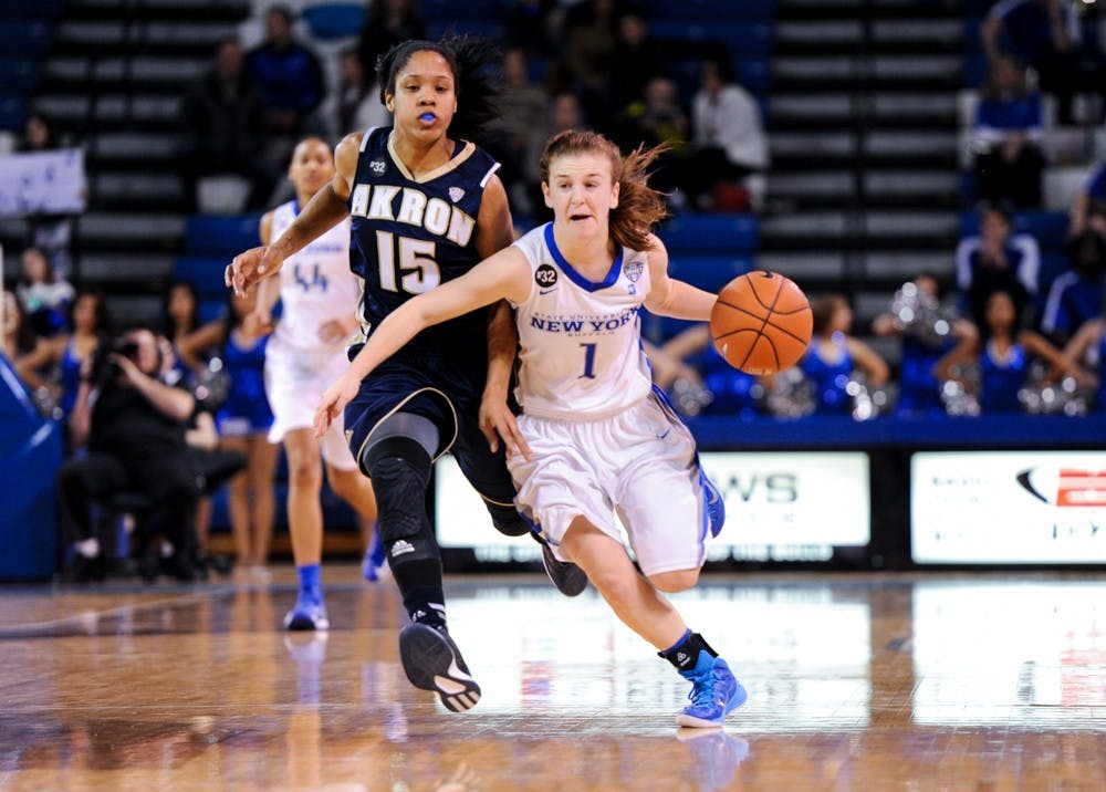 <p>Sophomore guard Stephanie Reid drives up the floor against Akrons' Anita Brown in Buffalo's 87-80 last season. </p>