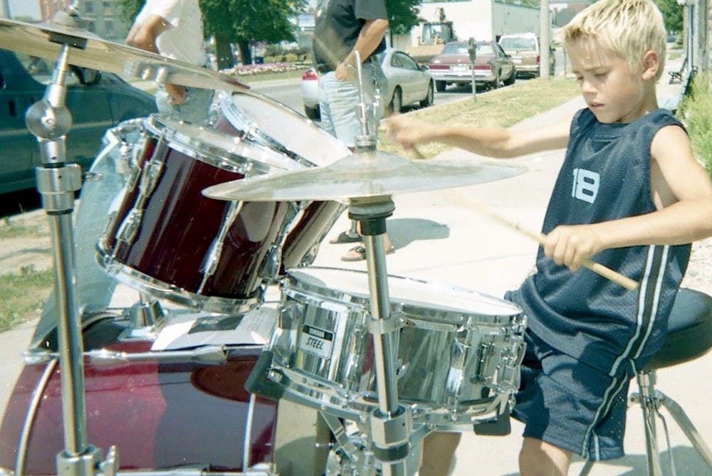 <p>Justin Bieber’s hometown is honoring him at the Stratford Perth Museum in Steps to Stardom, an exhibit which highlights Bieber’s journey to fame. Bieber was a regular street performer in Stratford, Ontario, as shown above playing drums in 2002.</p>