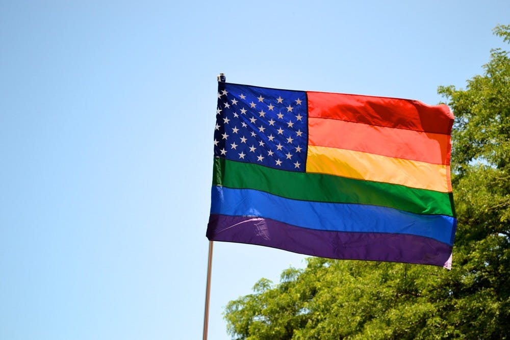 <p>A gay pride flag is waved. The Supreme Court is currently reviewing whether states have the right to ban same-sex marriage and not recognize same-sex marriages performed in other states.</p>