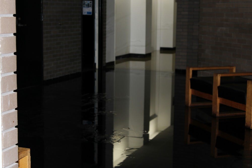 The fourth floor lobby of Clemens hall is flooded as a  result of a burst water valve on the fourth floor cooling system.