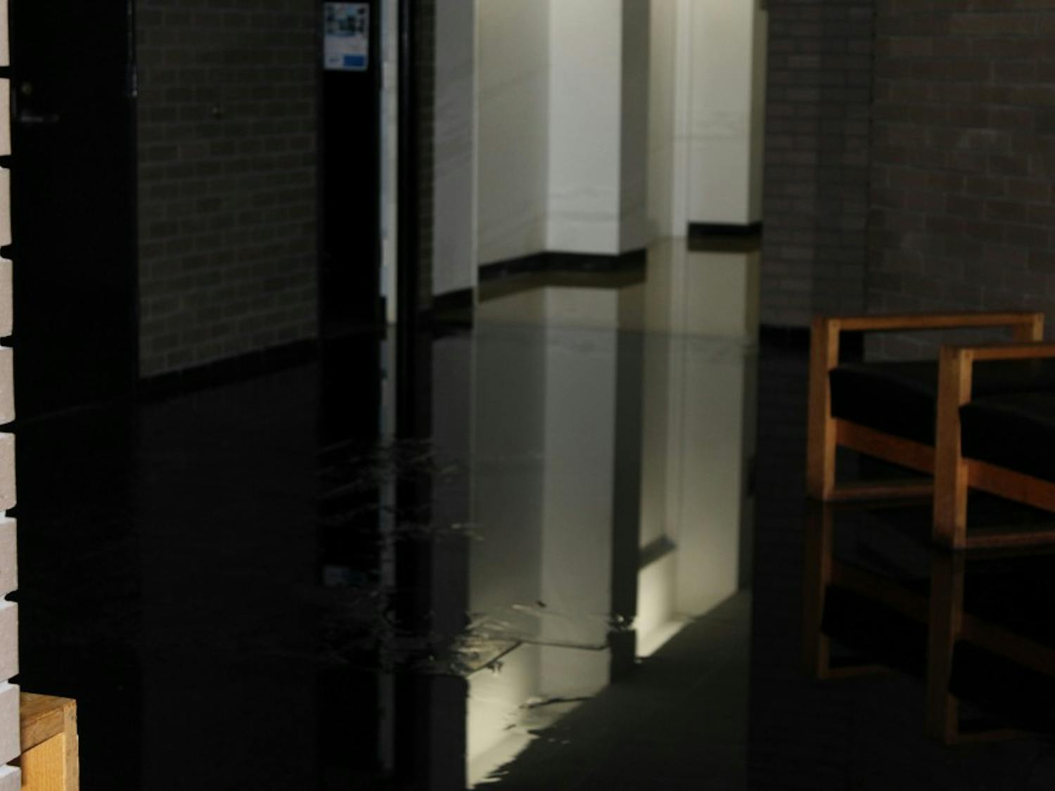 The fourth floor lobby of Clemens hall is flooded as a  result of a burst water valve on the fourth floor cooling system.