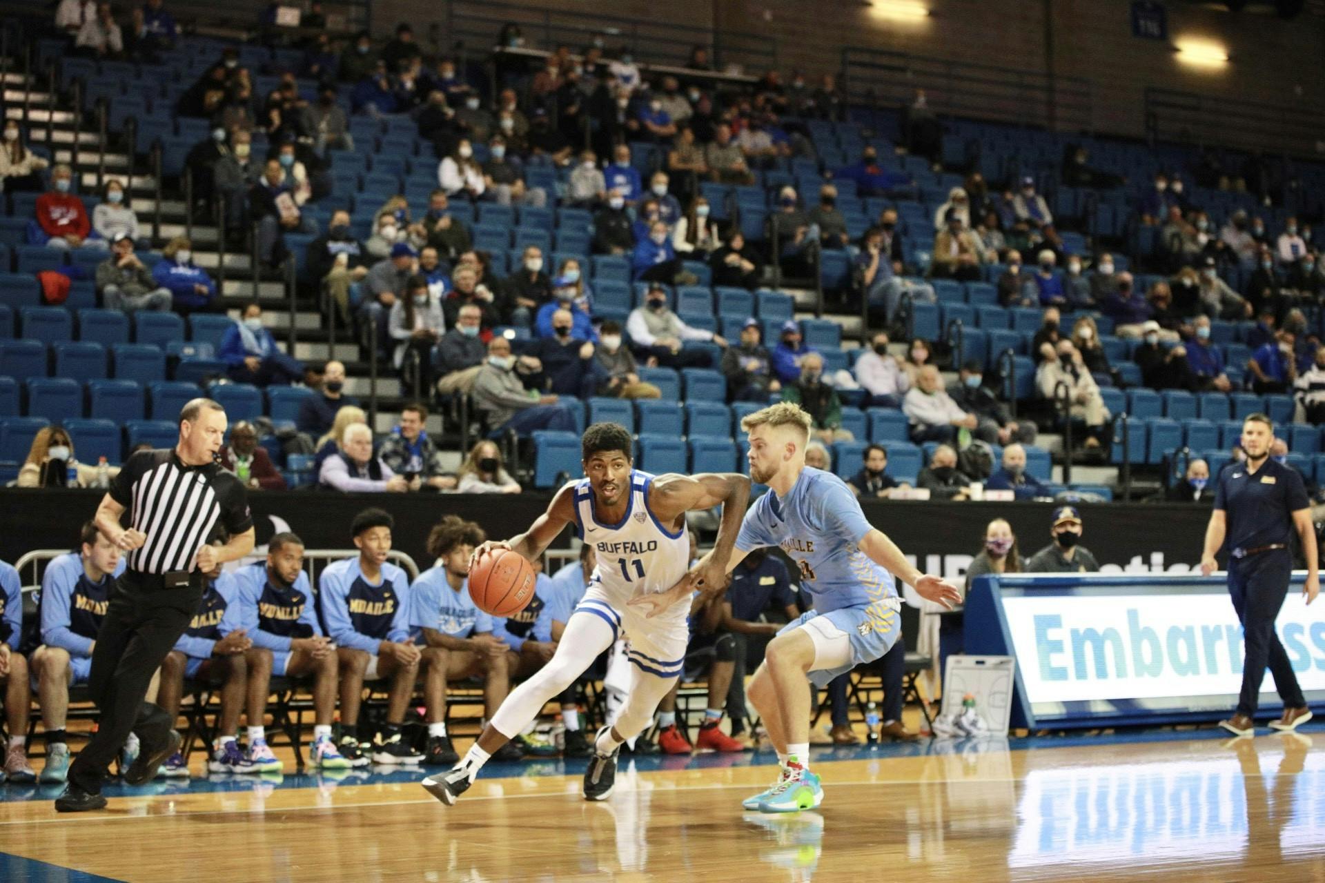 Senior forward Jeenathan Williams (11) drives into the lane during a 105-54 victory over Medaille Thursday.