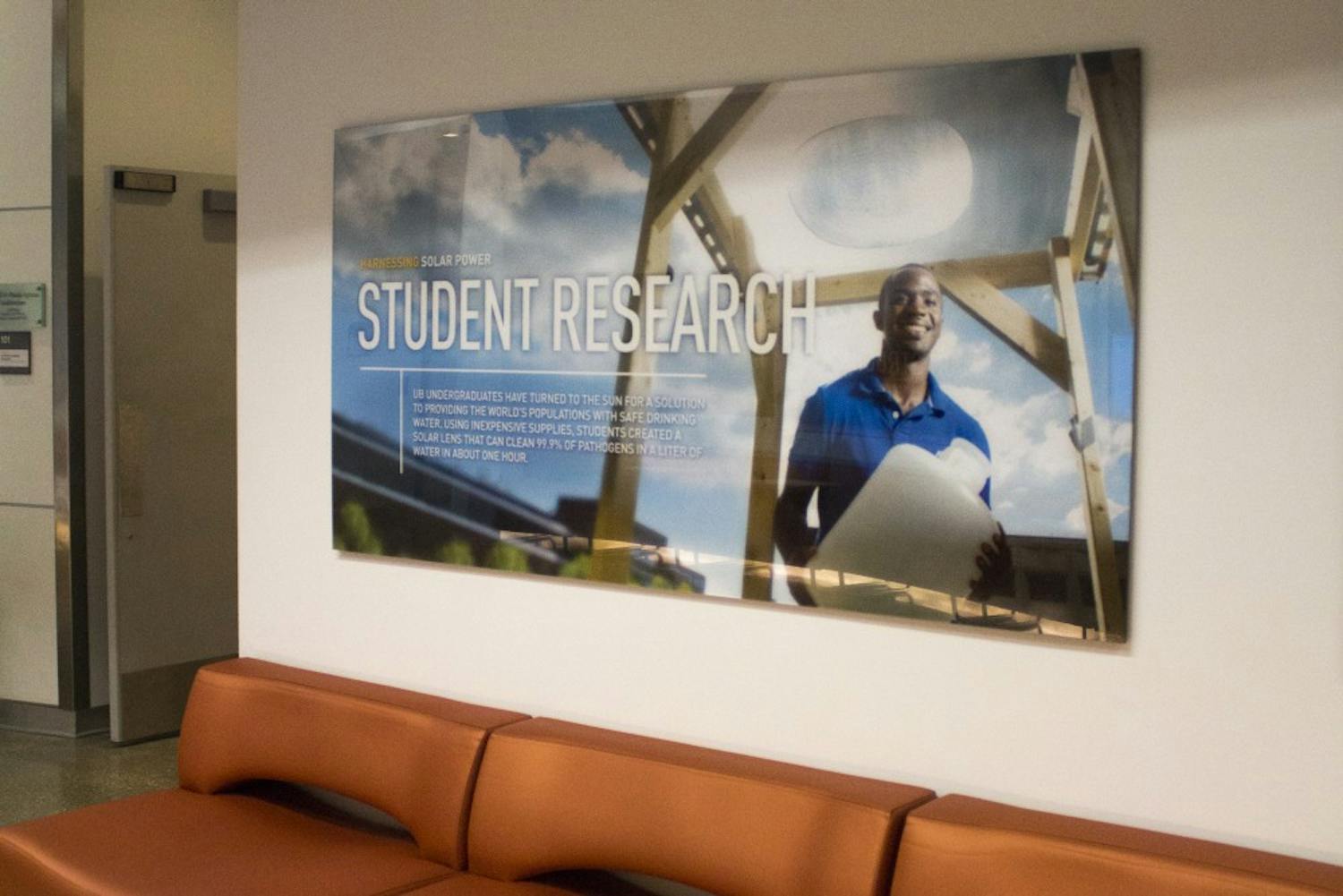 Deshawn Henry, a senior civil engineering major, appears on a poster in Davis Hall and on UB engineering pamphlets displaying student research.