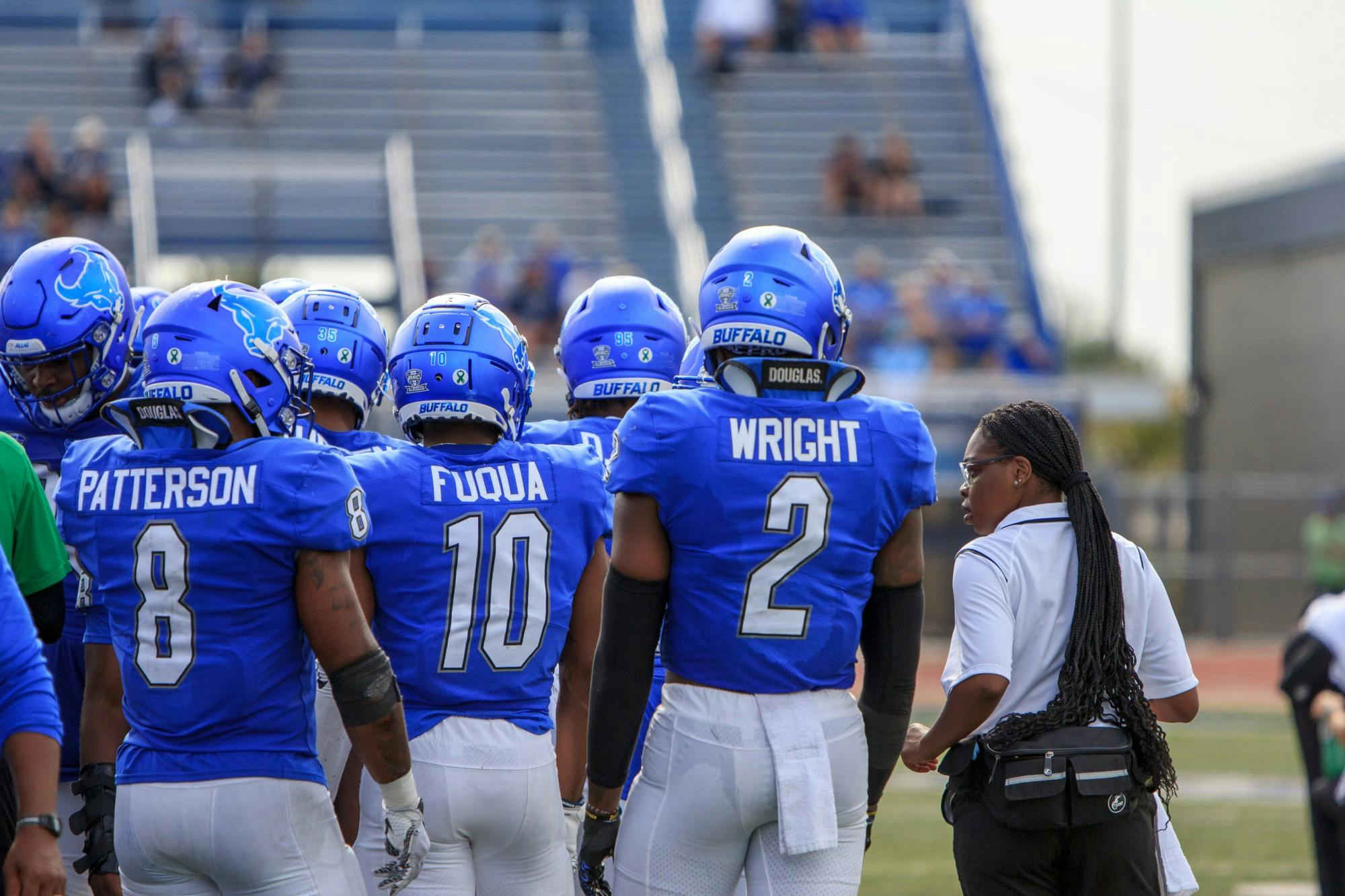 Safety Marcus Fuqua (10) and linebackers Kadofi Wright (2) and James Patterson (8) get ready during a timeout.