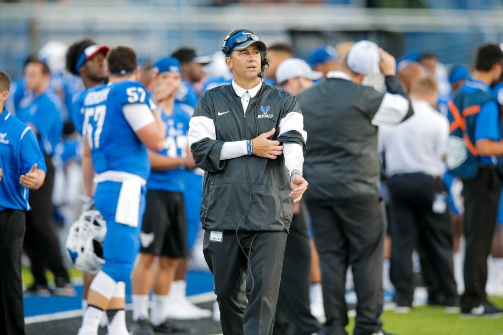 <p>UB quarterback Coach Jim Zebrowski stands on the sideline. Zebrowski is in his first year as a coach for the Buffalo Bulls.</p>