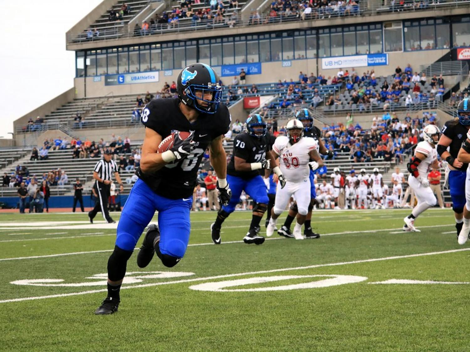 Senior receiver Jacob Martinez runs with the ball. The Bulls lost a close game 14-13 to the Northern Illinois Huskies.