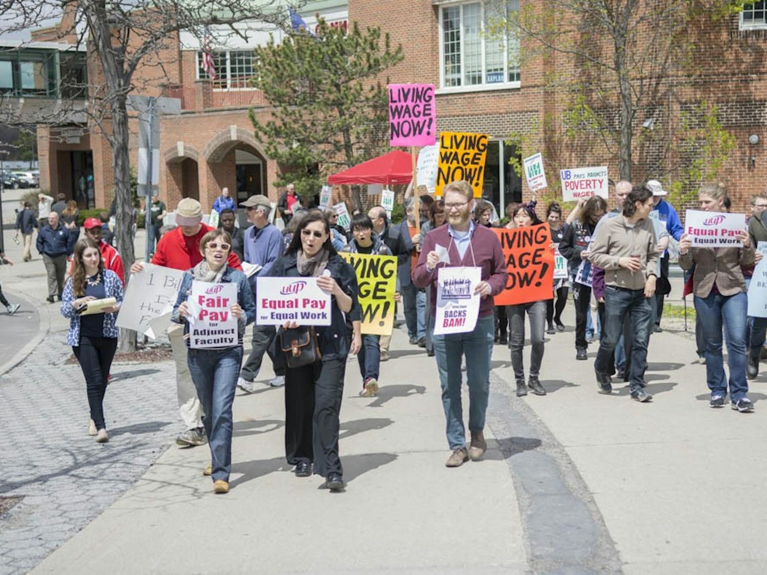 Roughly 60 adjunct professors, full-time professors, teaching assistants and undergraduate students held a rally with United University Professions outside of UB Commons Thursday afternoon.