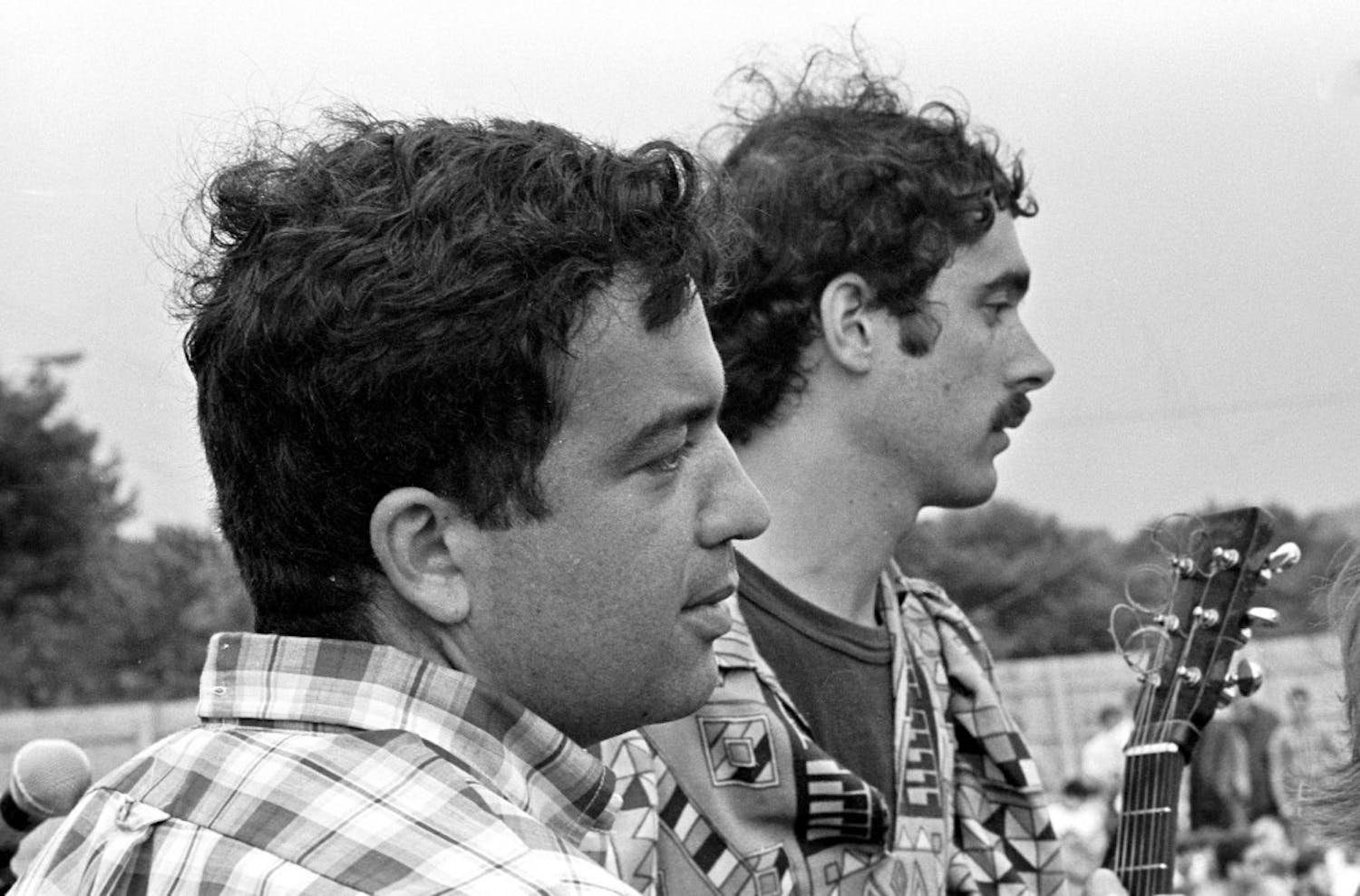 Professor Bruce Jackson (left) chats with Jim Kweskin (right) at the 1967 Newport Folk Festival. Jackson was on the festival board from 1965 to 1968. He claims that fans didn’t boo Bob Dylan during his infamous 1965 festival performance.