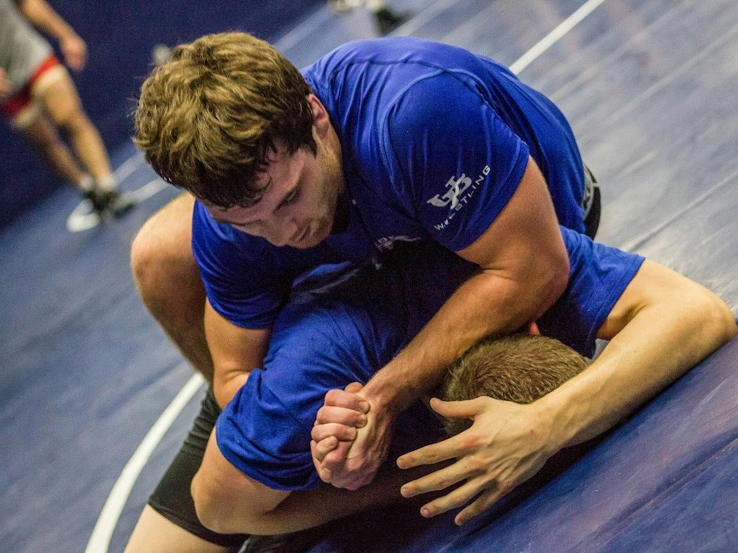 The wrestling team works on grappling at a practice last week. Members of the team have tried crash dieting to cut weight before, but there are much healthier ways to drop the pounds.