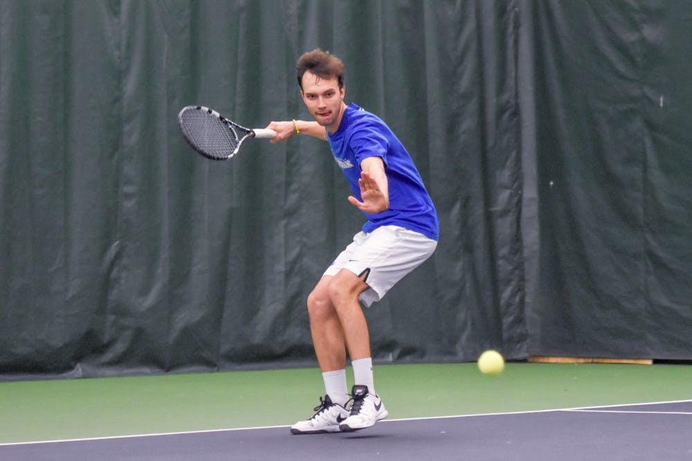 <p>Senior Sergio Arevalillo looks to return a serve back during a 2016 regular season event. Arevalillo won his 100th game in a 5-2 loss to Western Michigan on Sunday.&nbsp;</p>
