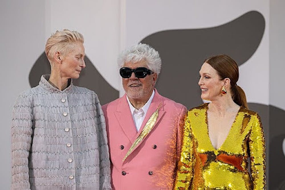 The cast of the film at the 81st Venice International Film Festival. From left to right, actress Tilda Swinton, director Pedro Almodóvar, and actress Julianne Moore.