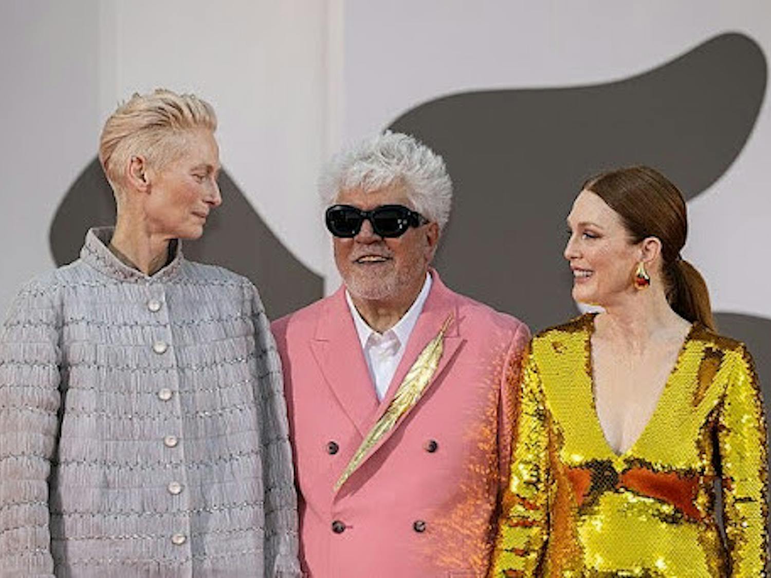 The cast of the film at the 81st Venice International Film Festival. From left to right, actress Tilda Swinton, director Pedro Almodóvar, and actress Julianne Moore.