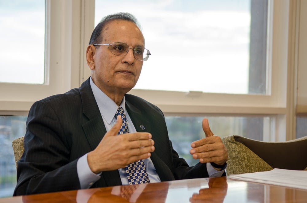 <p>President Satish Tripathi speaks with&nbsp;<em>The Spectrum</em> in his Capen fifth floor office in November of 2015.&nbsp;</p>