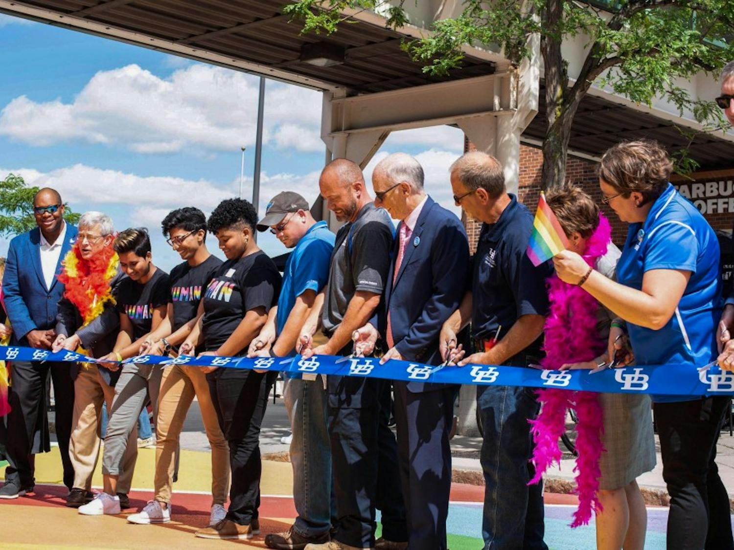 UB community members cut the crosswalk ribbon at Thursday's ceremony.