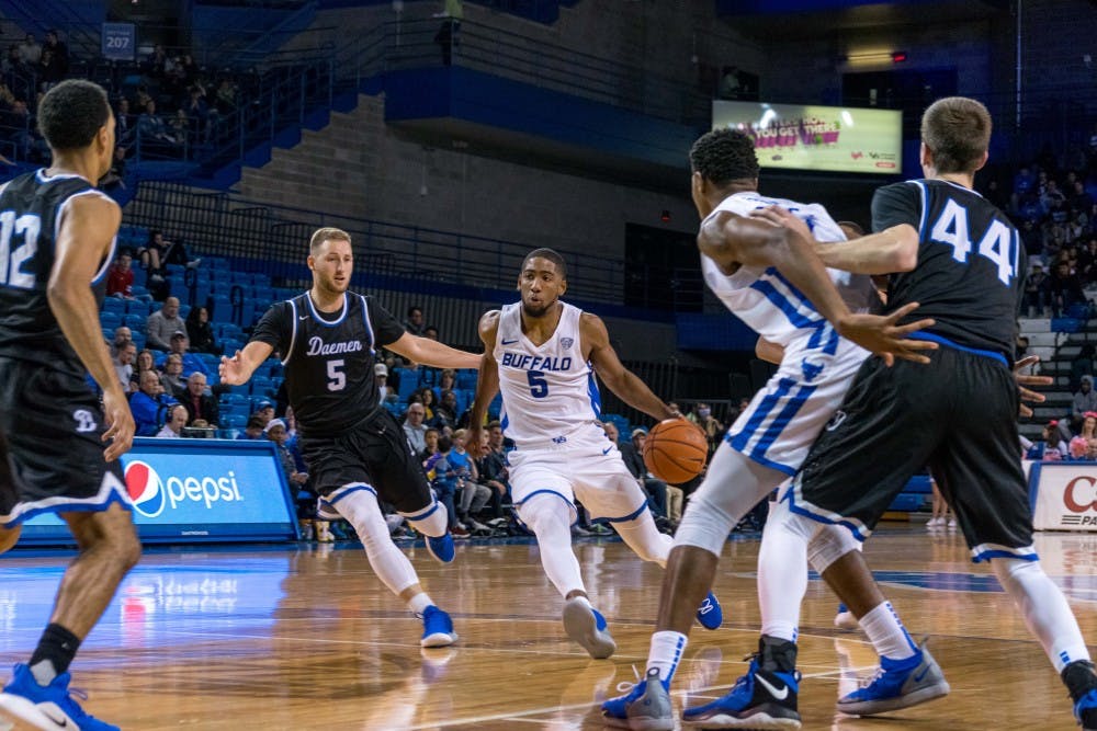 Senior guard CJ Massinburg dives through the lane against Daemen. Men’s basketball plays games against Syracuse and Marquette during the winter break.