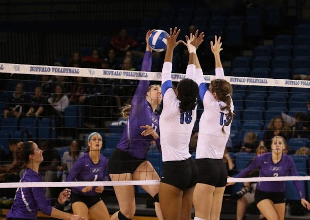 Junior outside hitter Tahleia Bishop and freshman Hannah Varley attempt to make a block in a 3-0 win over Niagara on Sept. 23. The Bulls dropped both matches this weekend.&nbsp;Yusong Shi, The Spectrum