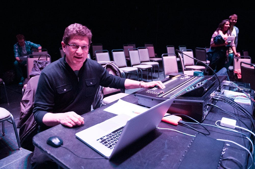 <p>The annual Black Box Concert was held on Wednesday in the Center for the Arts. Here, Cory Lippe, a professor in the music department and one of the organizers of the event, sits at the sound deck in the Black Box Theater.</p>
