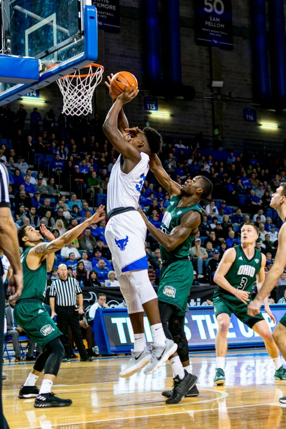 <p>Senior forward Nick Perkins goes for a layup against Ohio. Perkins finished with 17 points during the 82-79 victory as the Bulls secured the MAC regular season championship.</p>