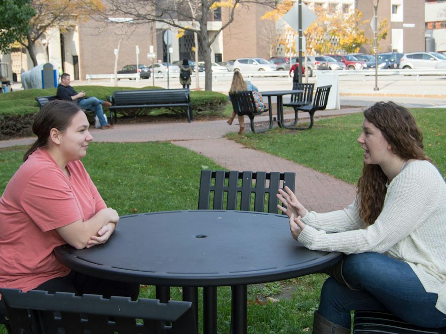 Danielle Dispenza (right) and Sarah Fullington (left) sit outside of the Student Union. Dispenza said she will vote for Hillary Clinton due to her disdain for Donald Trump and Fullington said she will not vote at all.