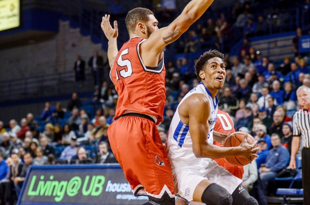 <p>Freshman guard CJ Massinburg drives into the rim during a matchup against Miami Ohio last weel. Massinburg has been a key contributor to the Bulls' recent stretch of success.&nbsp;</p>