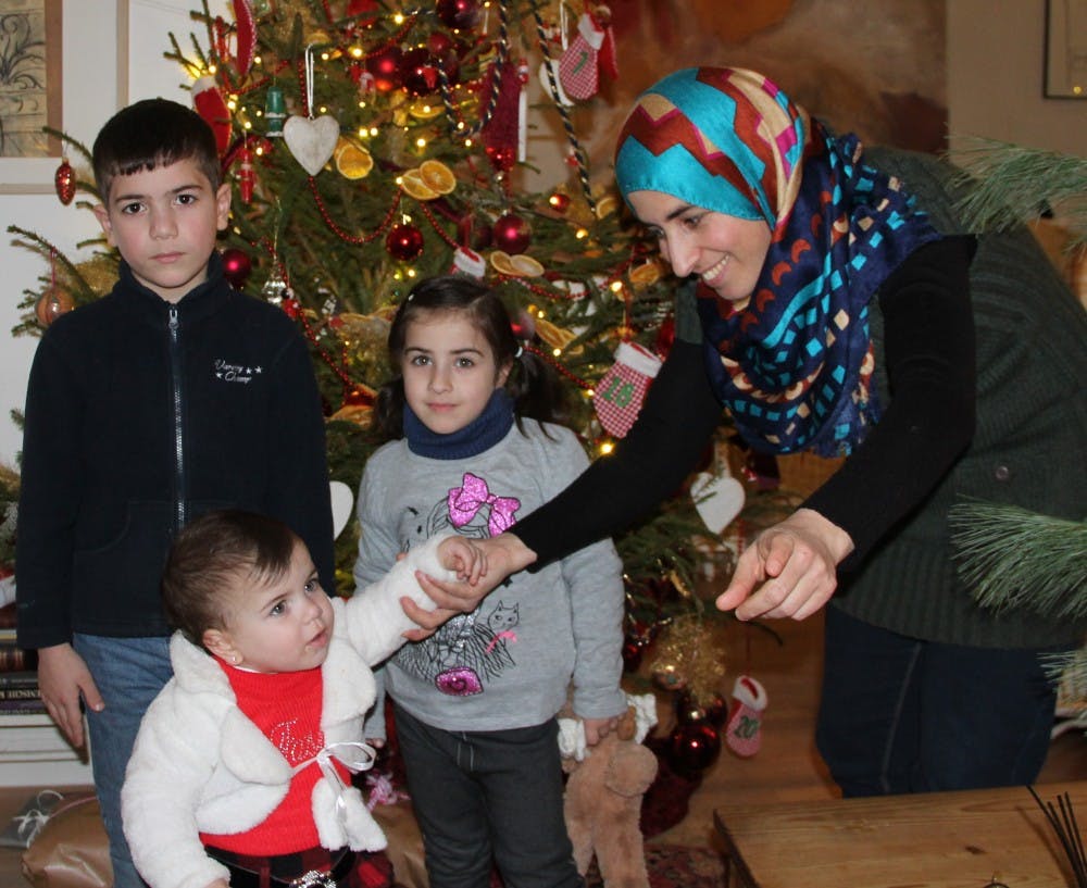 Lubna&nbsp;Albalkhi (right)&nbsp;and her children&nbsp;Mohammed, Bisan and&nbsp;Leen in Berlin&nbsp;around December 2015.&nbsp;The Albalkhi family, including Lubna's husband&nbsp;Sarhan,&nbsp;fled Syria in October.&nbsp;A German woman has helped them with their paperwork and to get jobs and homes in Berlin. She believes if every person helped one family, the refugee crisis would be over.&nbsp;