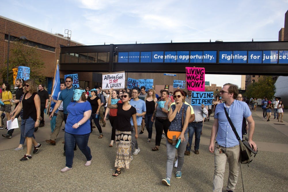 <p>Students and faculty marched from the Student Union to the administrative offices on the fifth floor of Capen Hall on Monday&nbsp;to advocate for a living stipend for graduate student instructors.</p>
