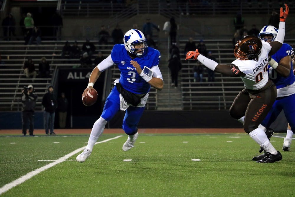 <p>Sophomore quarterback Tyree Jackson running out of the pocket. Jackson lead the Bulls to a 38-28 win over the Bowling Green Falcons Tuesday night.</p>