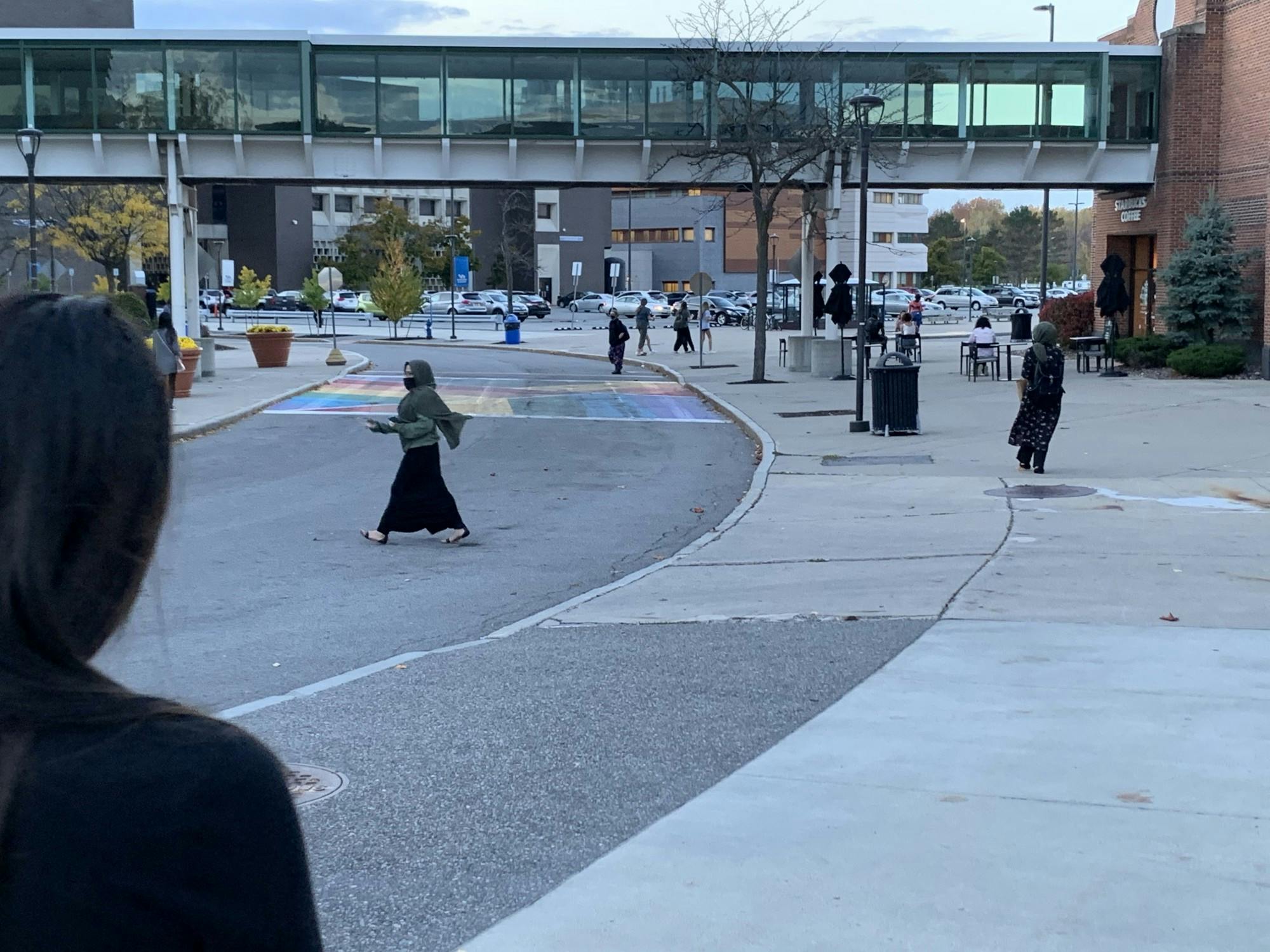 Students walking outside the Student Union and The Commons