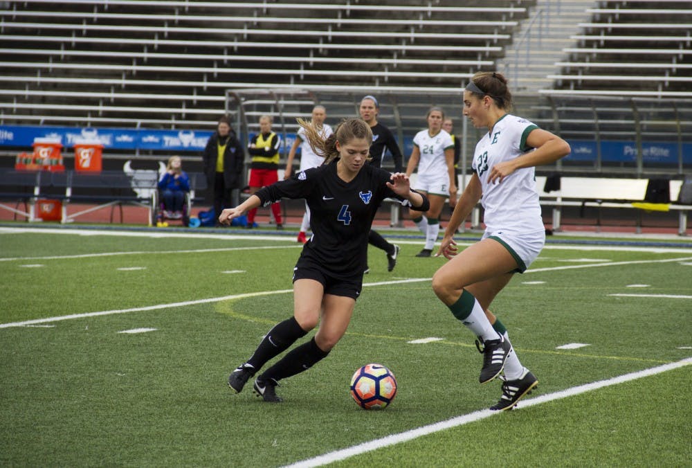<p>Sophomore midfielder Kaitlyn Walsh dribbles past a defender. Soccer split the weekend 1-1 on the road in conference play.</p>