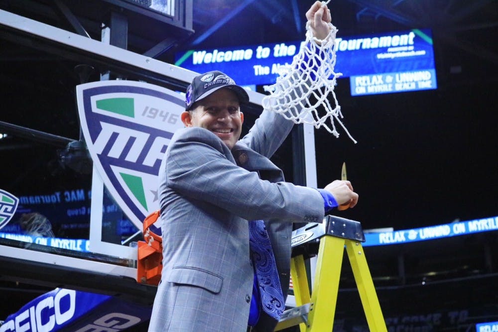 Nate Oats cuts down the net after winning the Mid-American Conference Championship. Oats is confident the Bulls can beat any team they play this year.