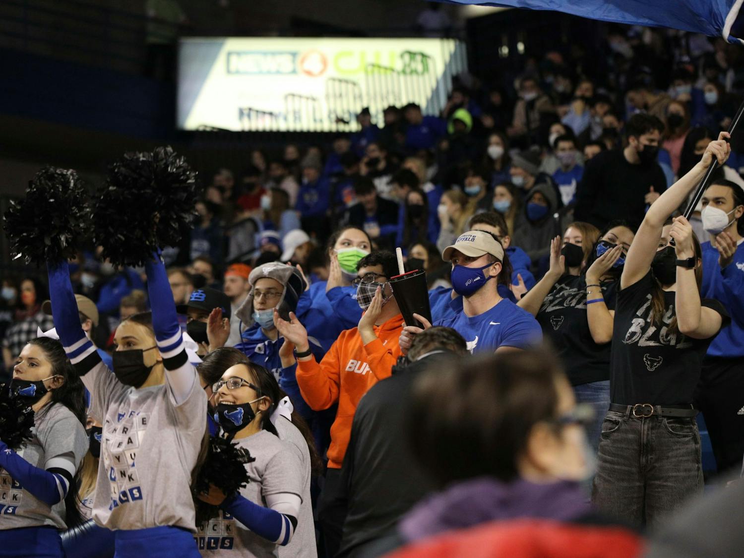 Members of the True Blue cheering section make noise during a near-sellout game against Toledo in February.