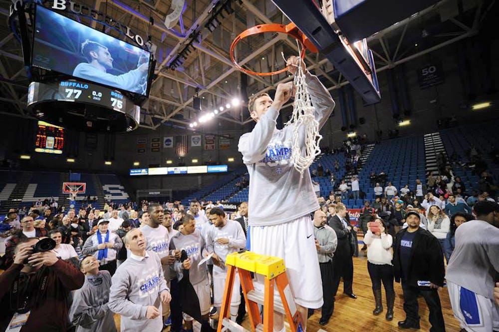 <p>Will Regan cuts down the nets after the Bulls' 77-75 victory over Bowling Green.  </p>