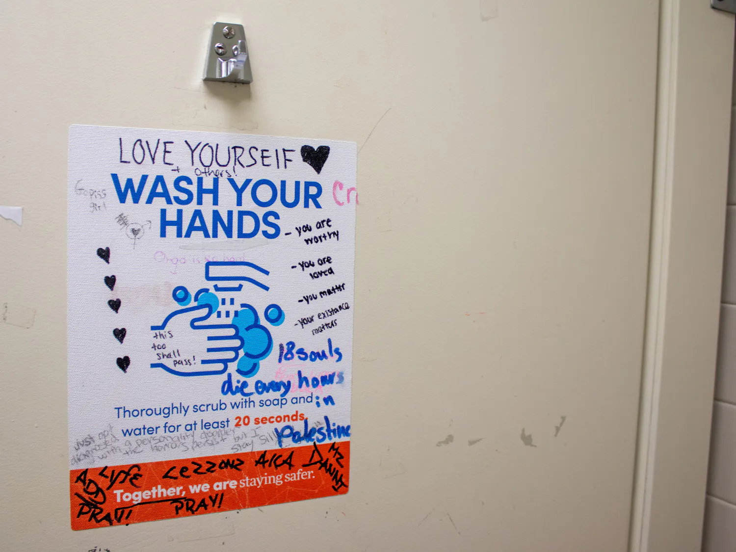 Graffiti peppers the walls of bathrooms of UB's campus.