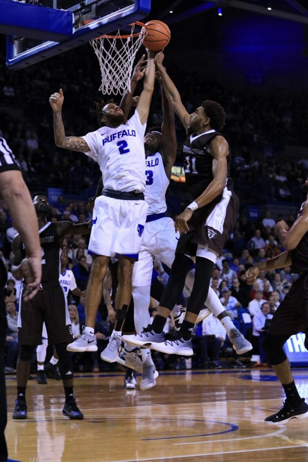 <p>Junior forward Jeremy Harris looks for the layup in heavy coverage. The men’s basketball team is looking to repeat its success from last season this year</p>