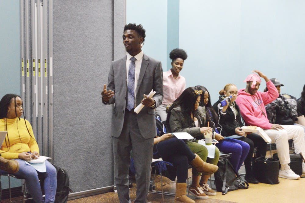 <p>Black Student Union Vice President Daniel Edwards addresses the room during a BSU meeting Wednesday. Club members and students shared their opinions on the amount of black faculty on campus and more.</p>