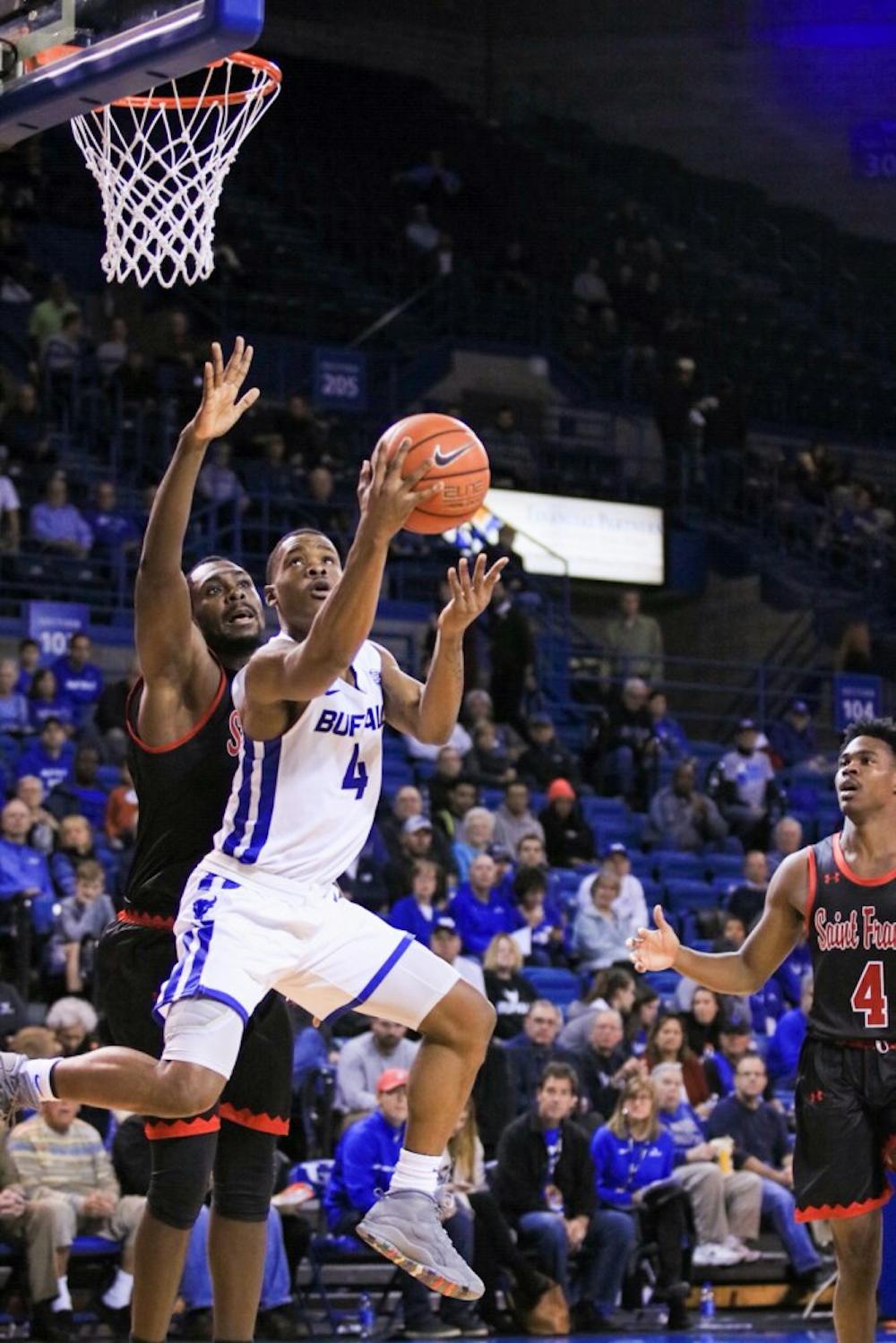 <p>Junior guard Davonta Jordan looks for the layup in the guarded paint. Jordan and the Bulls will head to Belfast, Northern Ireland for two games this weekend.</p>