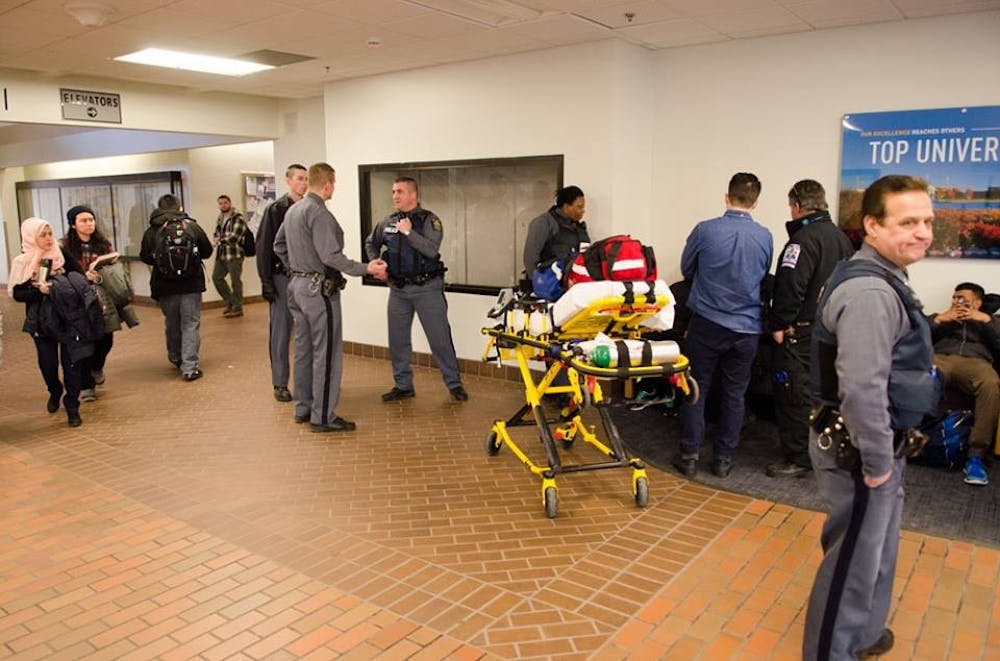 <p>University Police officers and first-responders tend to a student who&nbsp;reportedly suffered a seizure in the first floor hallway of Capen Hall&nbsp;Thursday. The student was responsive when speaking with medical personnel.</p>