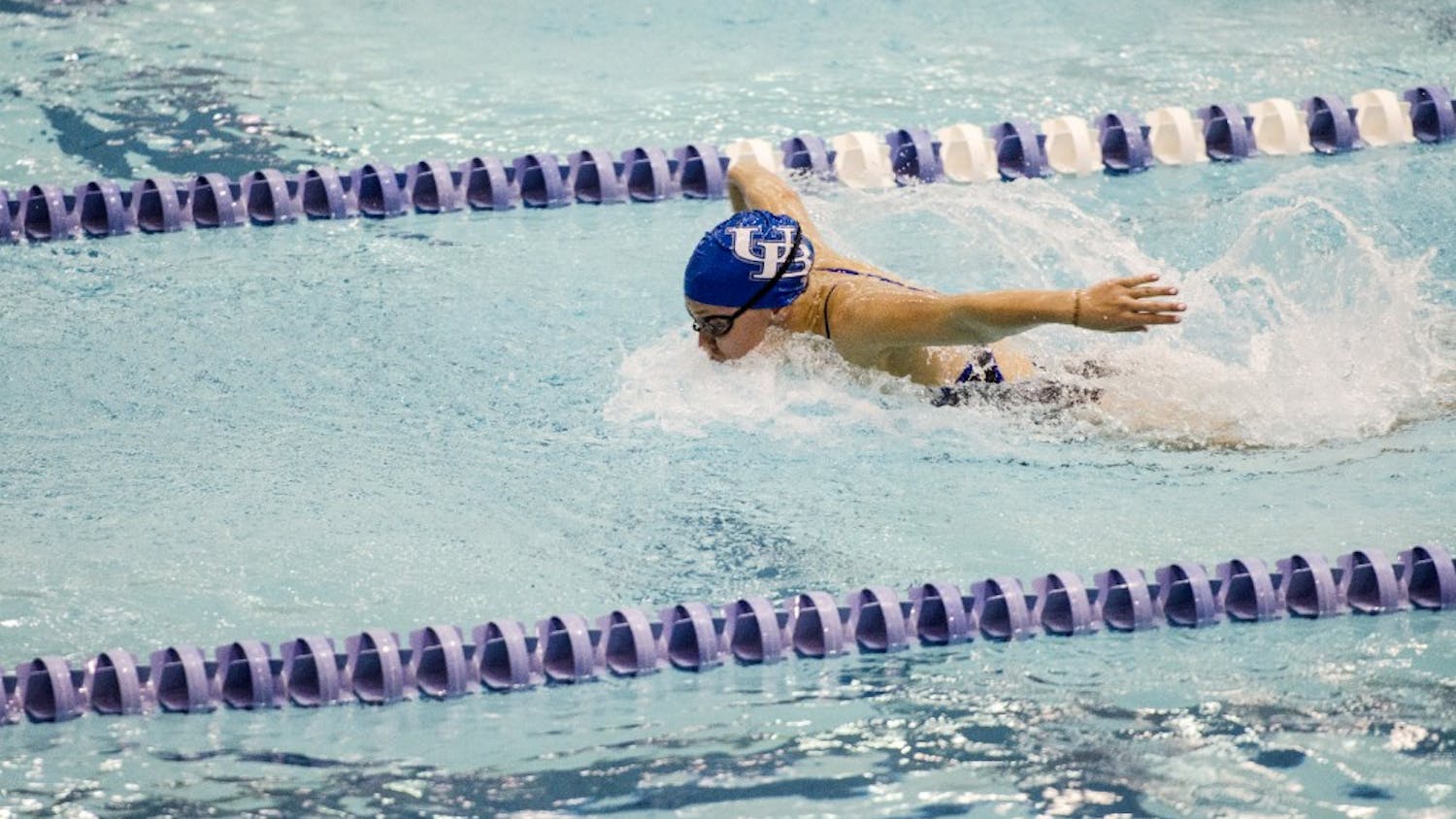 A women’s swimmer is competing in the butterfly heat during a match in October of 2015. The women’s swimming and diving team competed in the MAC Championships over the weekend.
