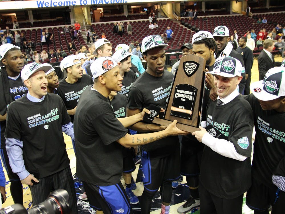 <p>Head coach Bobby Hurley and the rest of the Bulls hoist the program's first ever MAC Tournament championship trophy. The bulls defeated Central Michigan 89-84 on Saturday night at the Quicken Loans Arena in Cleveland, Ohio. The team will play in the NCAA Tournament beginning on March 17.</p>