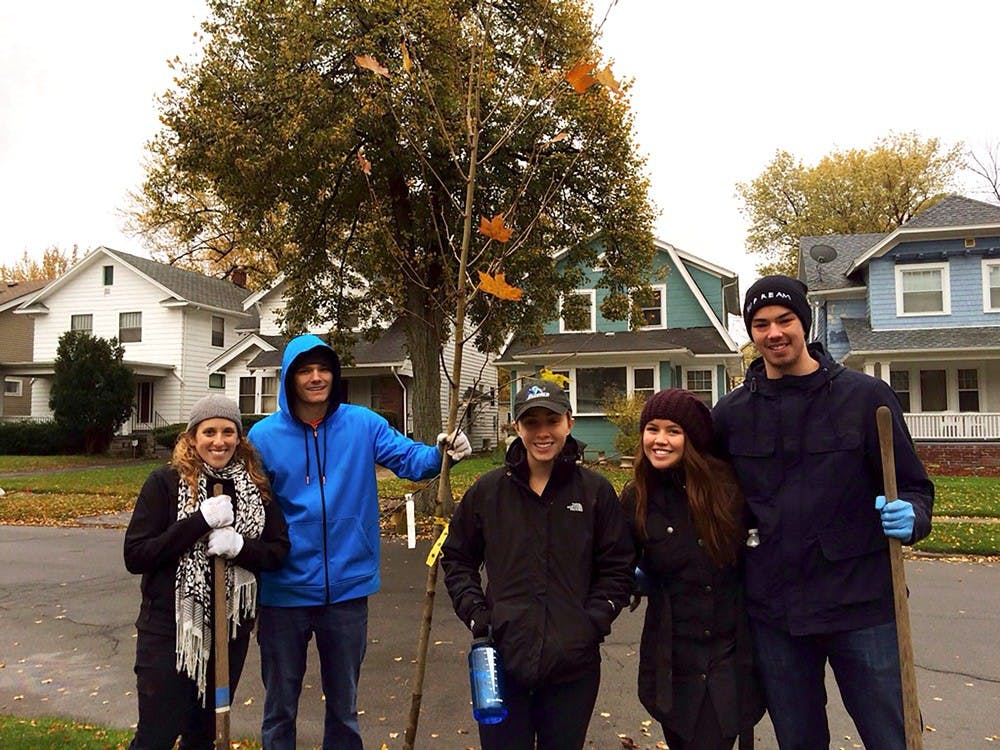 <p>From left to right: (sopho)MORE House instructor Terri Budek and students PJ Krohl, Julie Schoonover, Ely Cuberos and Tommy Tsang participate in Re-Tree Buffalo. (sopho)MORE House is a community and living class for Greiner Hall sophomores.</p>