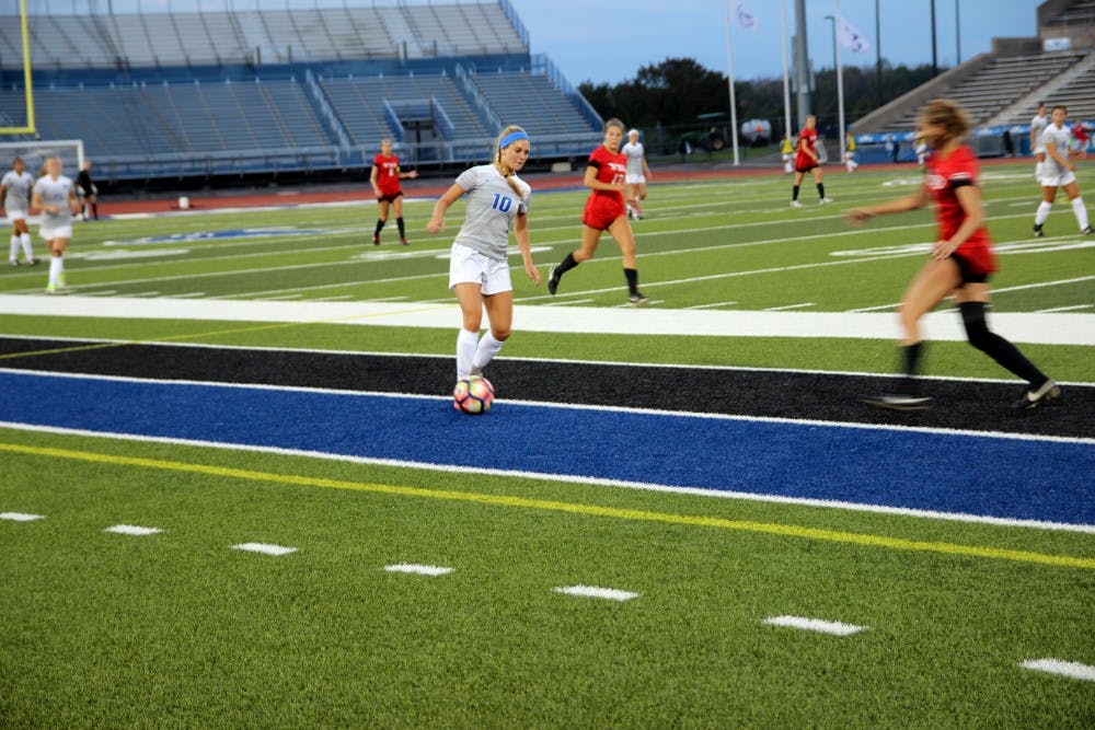 <p>Sophomore Kara Daly dribbles the ball down the sideline against Cornell. Daly had two assists in the Bulls weekend homestand.</p>