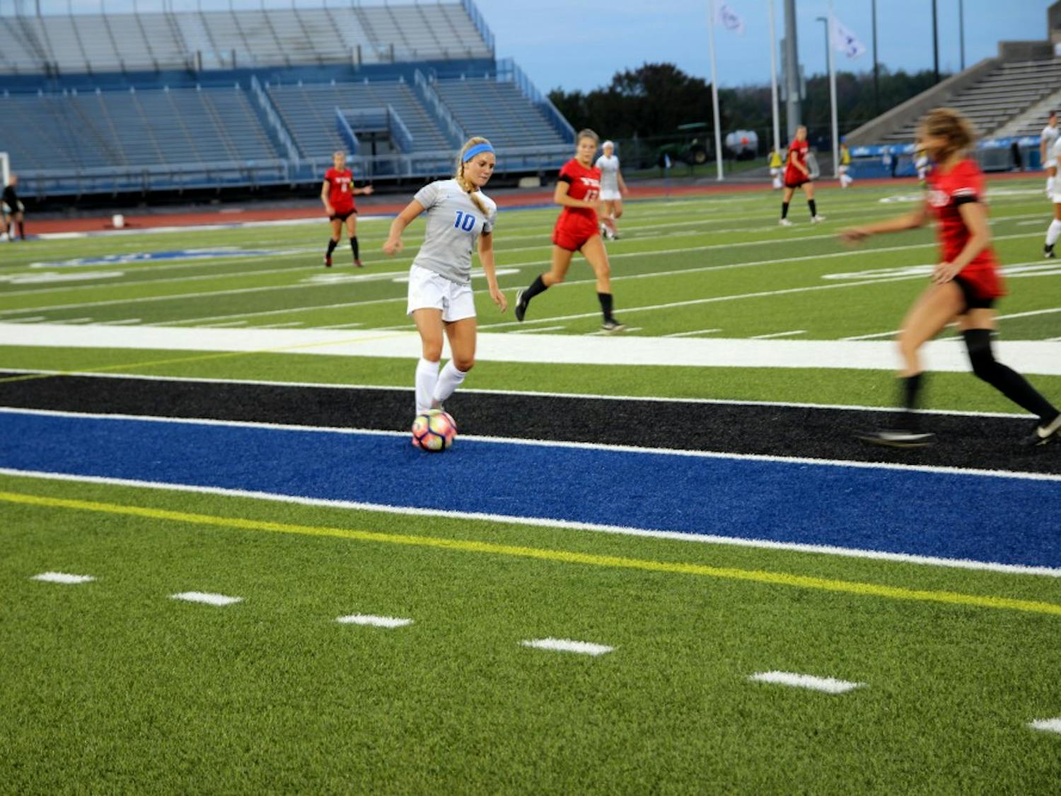 Sophomore Kara Daly dribbles the ball down the sideline against Cornell. Daly had two assists in the Bulls weekend homestand.