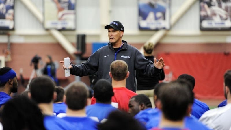 UB football head coach Lance Leipold talks to his team.