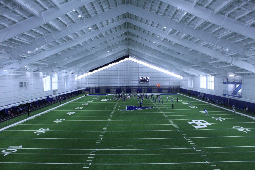 Football practices inside the fieldhouse on Thursday morning. The 92,000 square foot facility will house practices, university events, recreation and intramural sports.