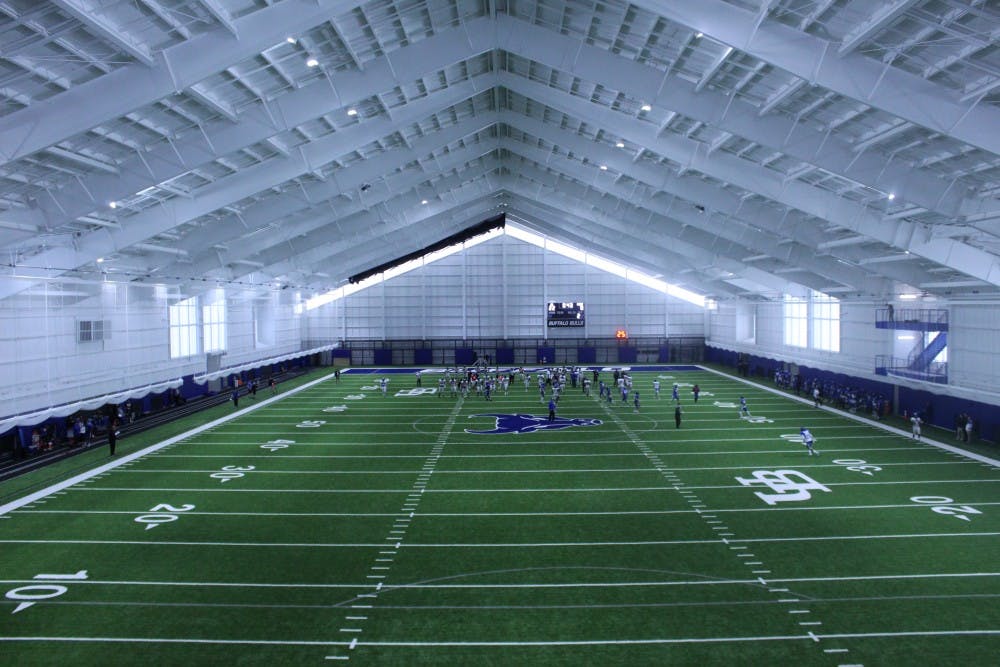 <p>Football practices inside the fieldhouse on Thursday morning. The 92,000 square foot facility will house practices, university events, recreation and intramural sports.</p>