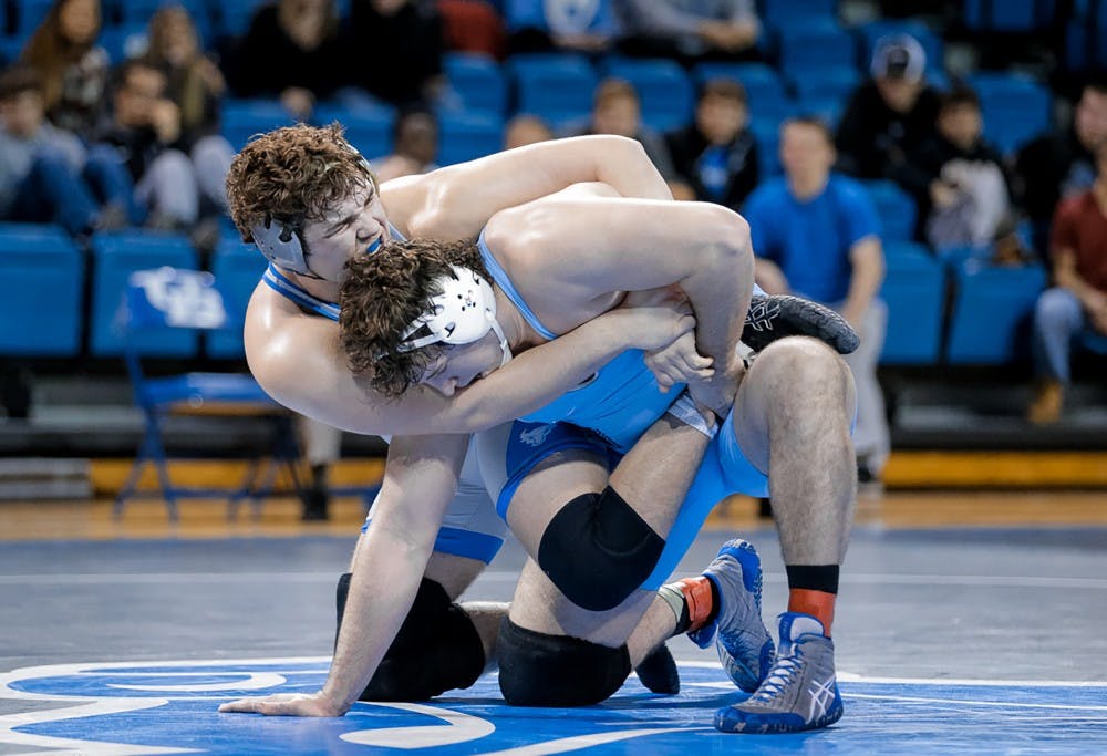 <p>Jake Gunning competes in spring 2016 match. Gunning is one of three wrestlers heading to the NCAA tournament this year.&nbsp;</p>