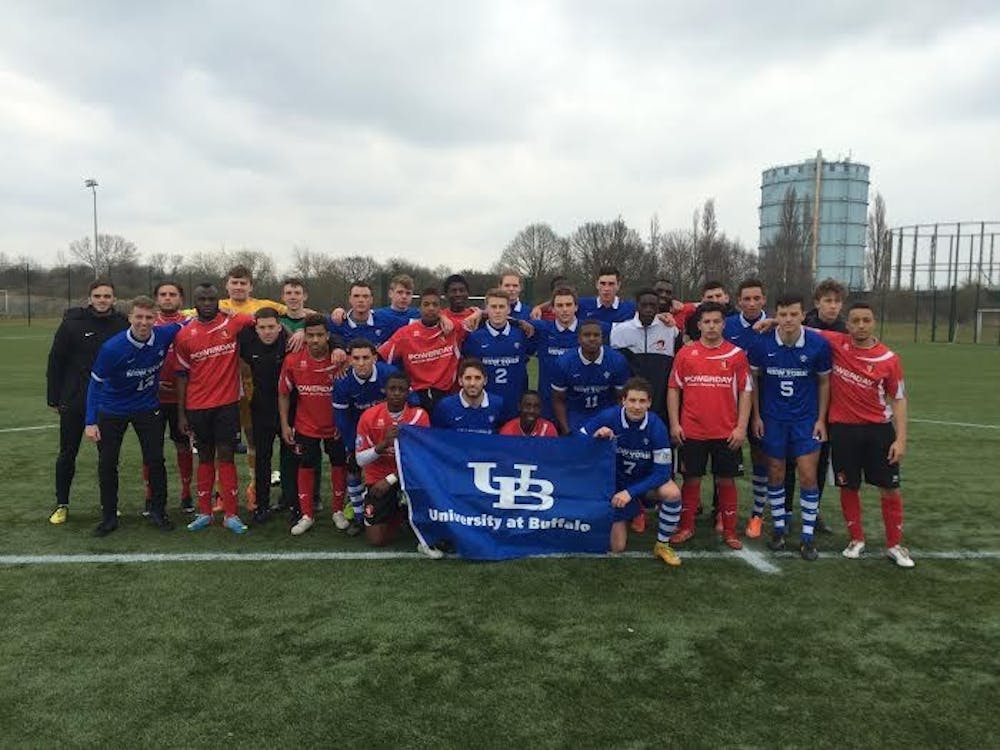 <p>The men’s soccer team poses with Hayes and Yeading FC. The Bulls traveled to the United Kingdom over spring break and went 4-0 in competition that ranged from U19 teams to professional squads.</p>