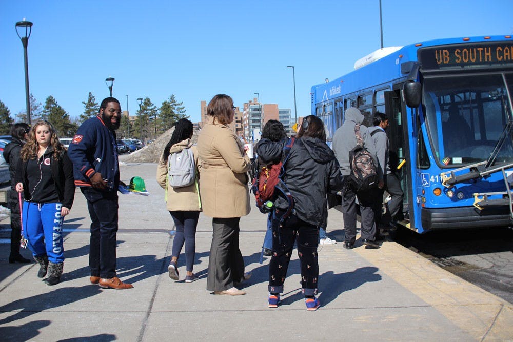 <p>Students wait to board a Stampede bus.&nbsp;Some students who took UB transportation to Monday's&nbsp;Bernie Sanders’ rally were upset due to long lines of community members boarding the buses while other students avoided taking the Stampede altogether.</p>